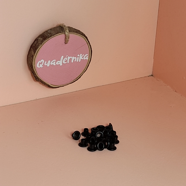 Paq. con 20 pzas de Ojillos Negro